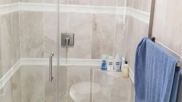 Shower, hair dryer, towels, soap