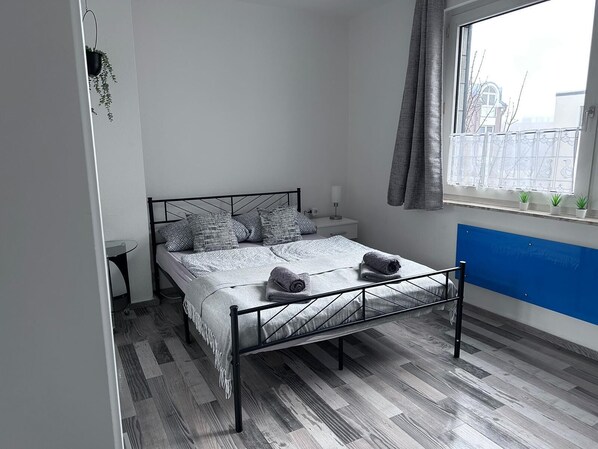 1 bedroom, desk, iron/ironing board, travel crib