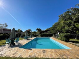 Outdoor pool, pool umbrellas, sun loungers