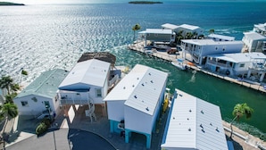 A coastal property with multiple buildings, a dock, and a marina. - Waterfront, Boat Dock, Heated Pool, Ocean Views #135 (Cudjoe Key)