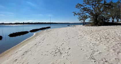 Renovated 1970âs retro camper on Bayou Grande in Pensacola with walking trail.