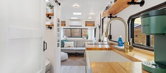Renovated 1970’s retro camper on Bayou Grande in Pensacola with walking trail. 