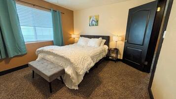 1 bedroom, desk, iron/ironing board, travel crib