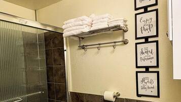 Shower, hair dryer, towels, soap