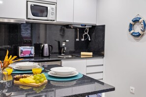 Fridge, microwave, coffee/tea maker, electric kettle