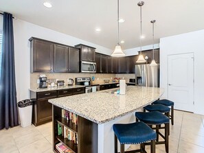 Fridge, microwave, oven, stovetop - Windsor Westside Gorgeous 8BR Villa,Pool,By Disney (Kissimmee)