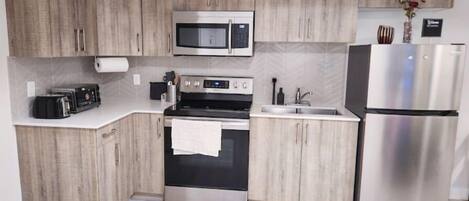 Microwave, cookware/dishes/utensils, paper towels