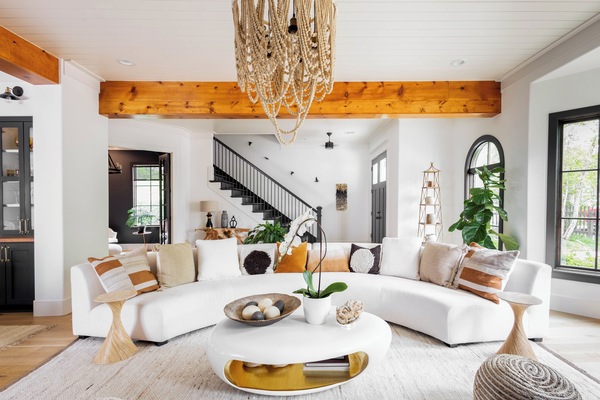 Living and room and front entrance facing Main street. This room will also be featured on HGTV Fixer to Fabulous promo spot. You can design your own version of our living room in the Design Home app.