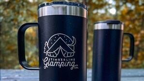 A black thermos with a camping logo and the text "Timberline Camping Co." on a wooden surface. - Luxury Spacious Glamping, Lake View, Grill, Pool, Pet Friendly, Swim (Delta)