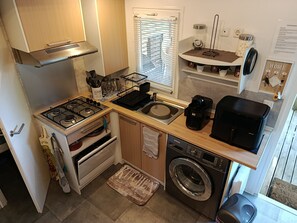 Fridge, microwave, stovetop, coffee/tea maker