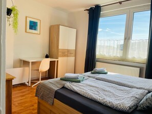 1 bedroom, desk, iron/ironing board, travel crib
