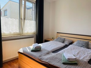 1 bedroom, desk, iron/ironing board, travel crib