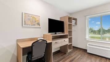 Desk, laptop workspace, bed sheets