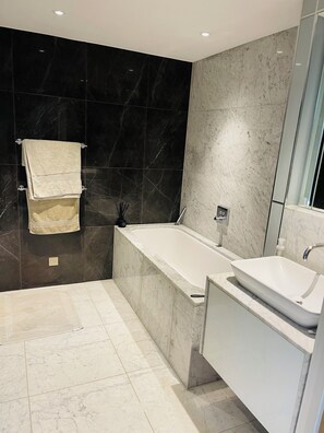 Shower, hair dryer, towels, soap