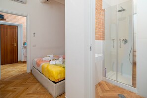 Shower, hair dryer, towels, shampoo