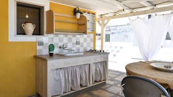 Fridge, coffee/tea maker, highchair, cookware/dishes/utensils