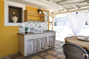 Fridge, coffee/tea maker, high chair, cookware/dishes/utensils