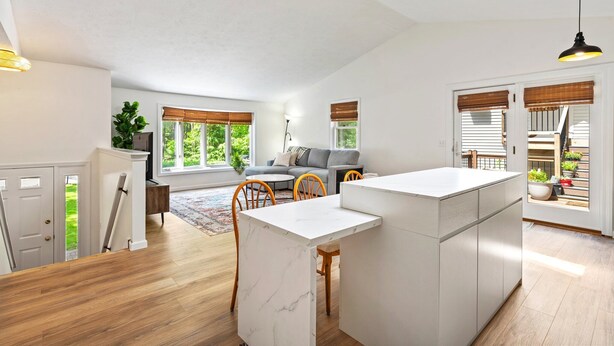 A spacious kitchen with a central island, wooden flooring, and large windows with blinds. - Scarborough Sanctuary-Cozy retreat close to all local attractions. (Scarborough)