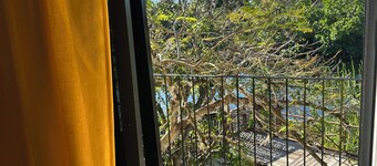 Lovely River view  two bedrooms on The banks of Black River. Breakfast Included!