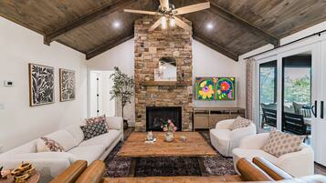 Smart TV, fireplace, books, offices