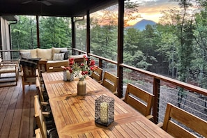Outdoor dining - Spacious & Modern Rumbling Bald Retreat! Hot Tub, Fire Pit, Game Room (Lake Lure)