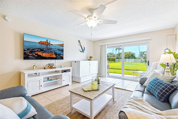 Comfortable living room with natural light and cozy seating for relaxation