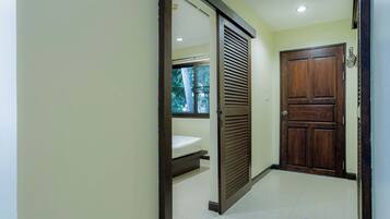 Exclusive Condo, Balcony, Garden View | Living area | Flat-screen TV