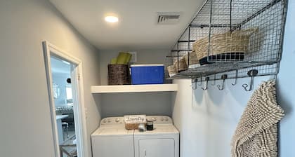 Relax here with beach views, steps to the beach, fenced in yard, pet friendly