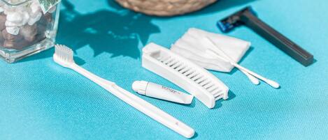 A set of personal care items on a blue surface.