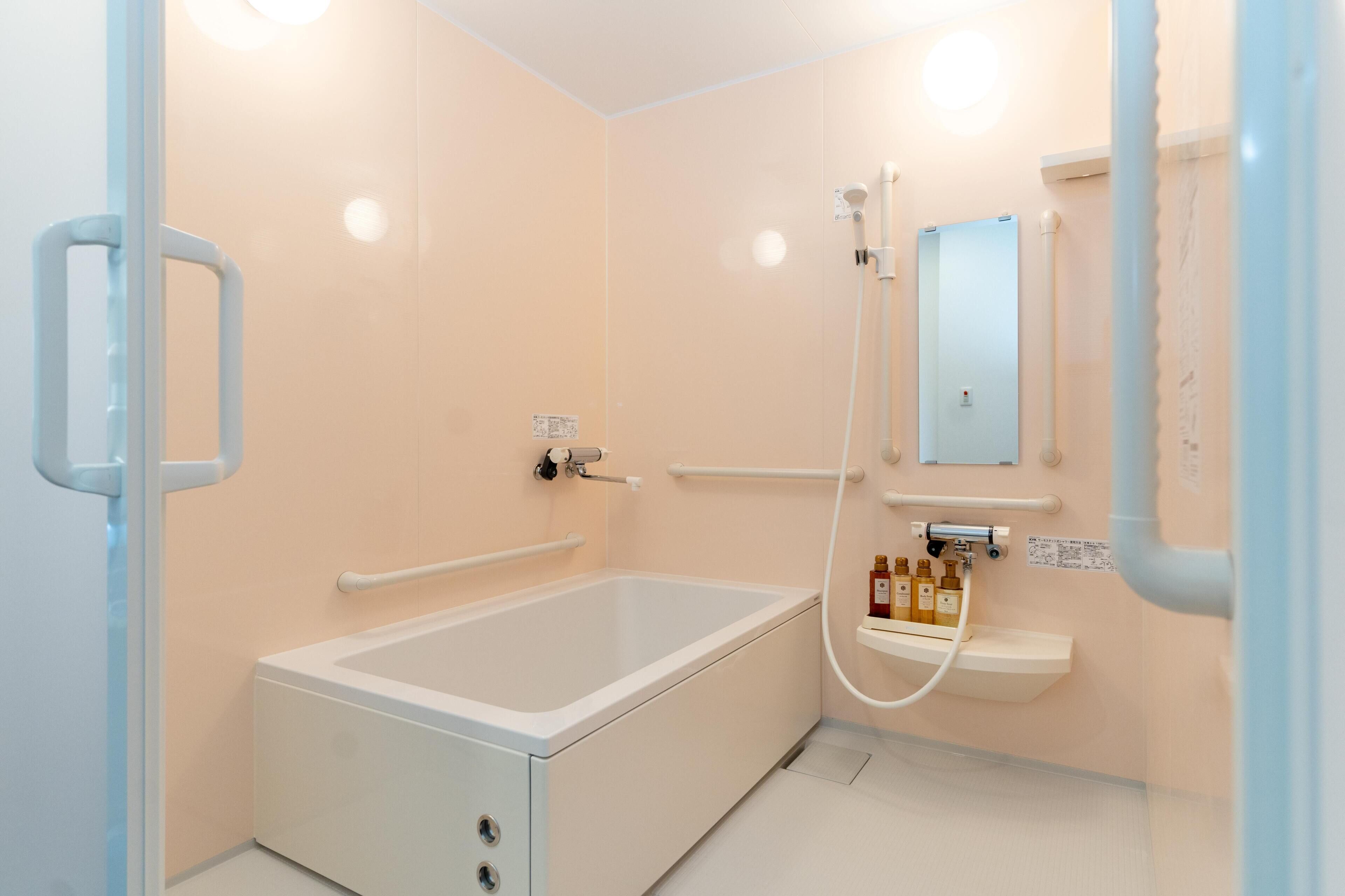 Standard Single Room, 1 Large Twin Bed, Non Smoking | Bathroom | Combined shower/tub, free toiletries, hair dryer, bathrobes