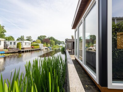 Big Chalet in Friesland by the water with sloop