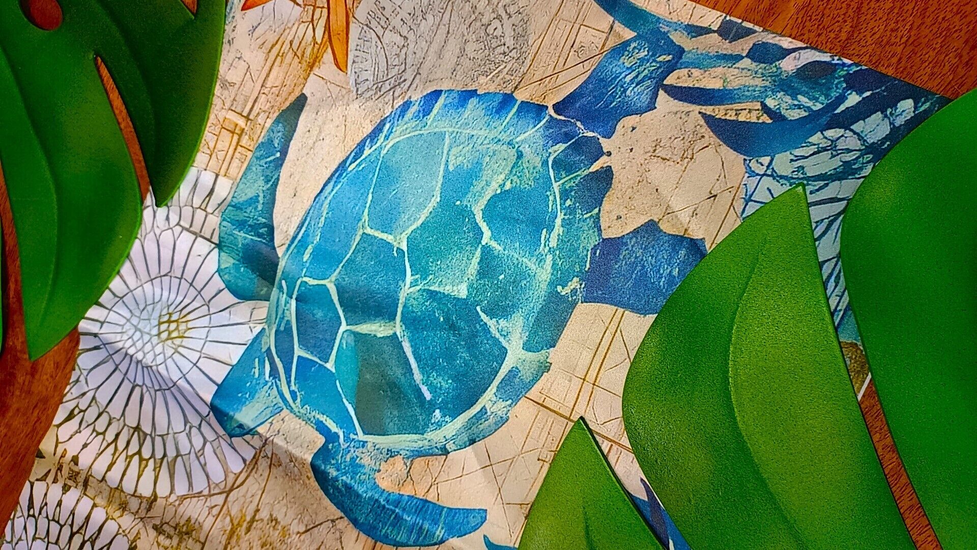 A detailed mosaic of a sea turtle on a textured surface.