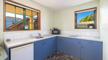 Fridge, microwave, stovetop, cookware/dishes/utensils