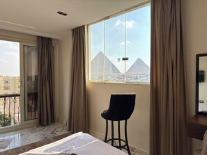 Junior Room, 1 King Bed | Minibar, in-room safe, soundproofing, iron/ironing board