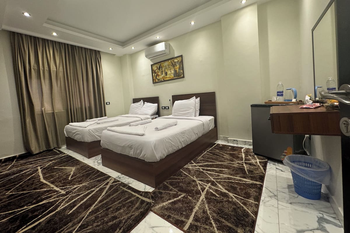 Standard Twin Room, 1 Bedroom | Minibar, in-room safe, soundproofing, iron/ironing board