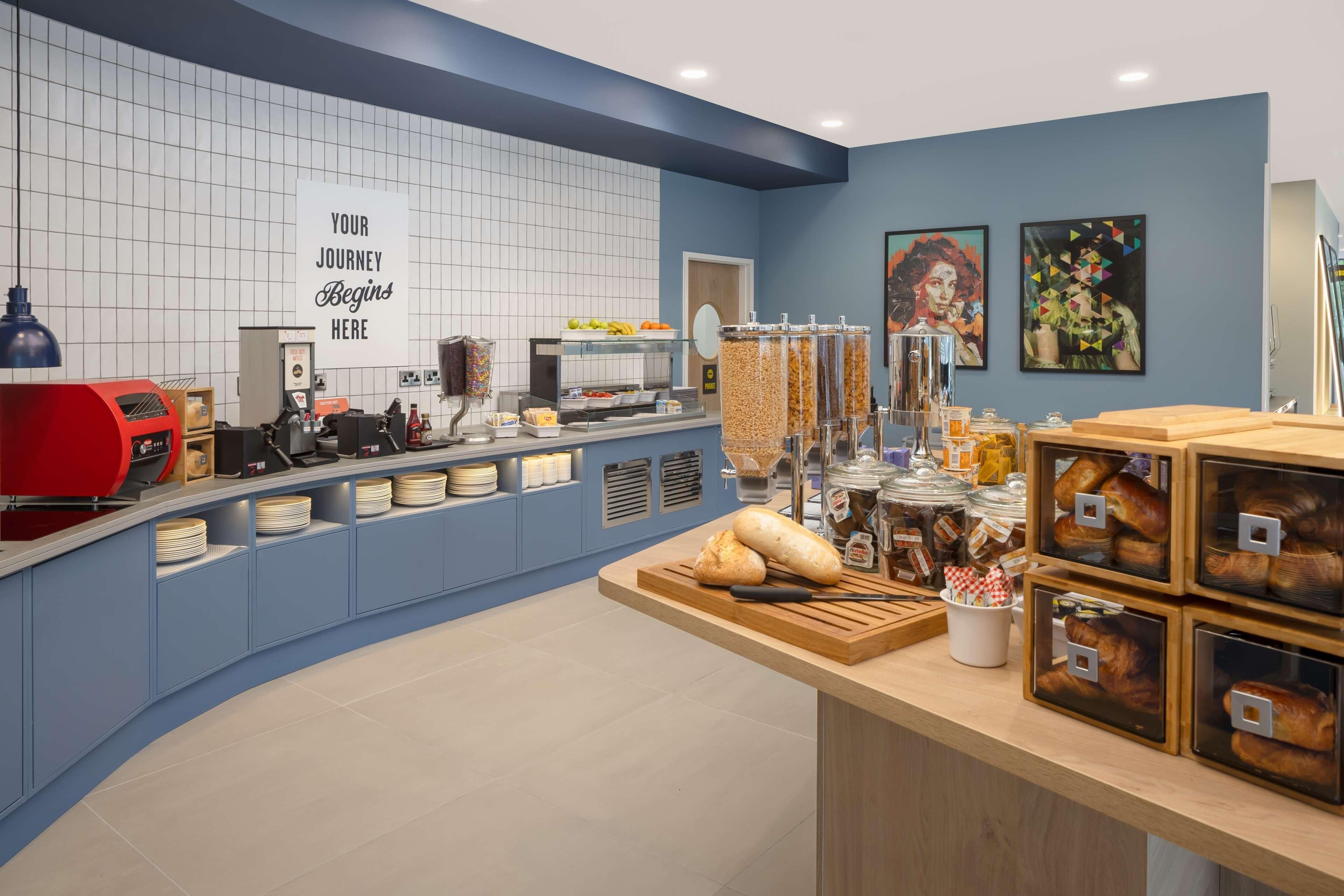 A bakery counter with various baked goods and a sign that reads "YOUR JOURNEY Begins Here".