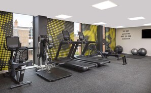 A gym with treadmills, a rowing machine, and exercise balls. - Hampton By Hilton Nuneaton (Nuneaton)