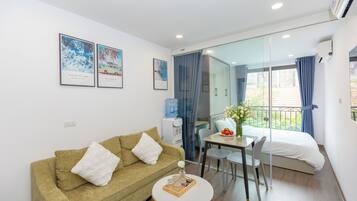 Luxury Apartment, City View | Living area | Smart TV
