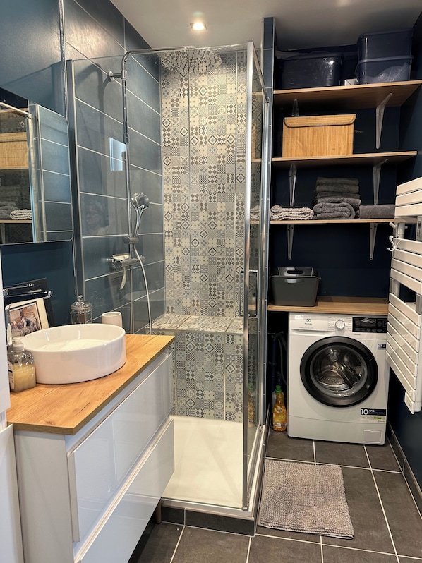 Shower, hair dryer, towels, soap