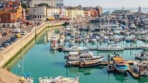 A marina with numerous boats docked, a clear sky, and buildings in the background. - Family Seaside Bungalow - Max 6 Adults Only - 2 Small -Medium Sized Dogs Welcome - Nr Beach (Margate)