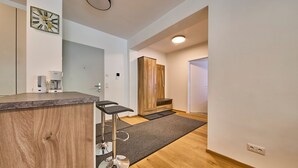 Classic Apartment, Balcony, Mountain View | Living area | 50-inch flat-screen TV with cable channels, heated floors - Appartement Traumblick (Bad Hofgastein)