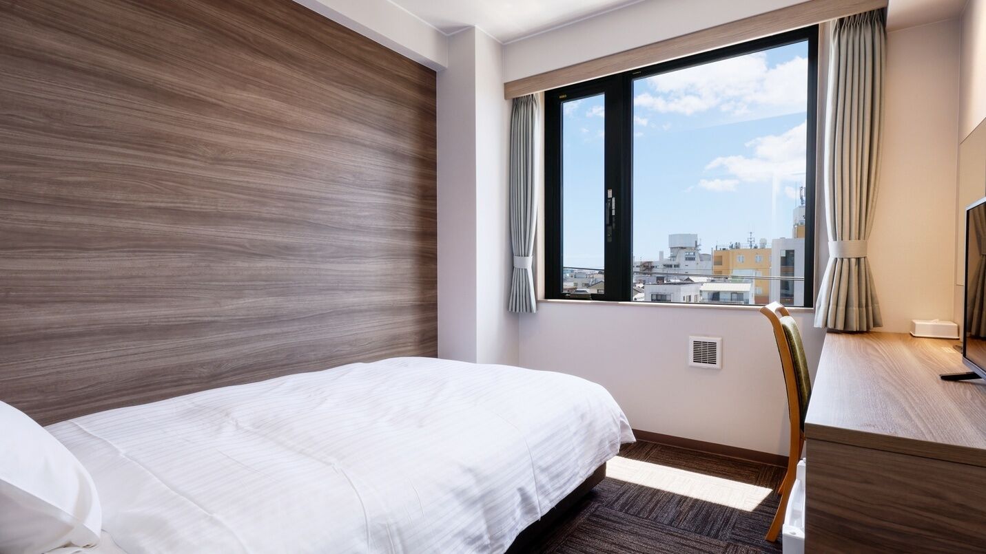 Desk, laptop workspace, free WiFi, bed sheets