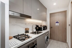 Comfort Apartment, Balcony, Courtyard View | Private kitchen | Full-sized fridge, microwave, oven, stovetop - New Stylish Studio in Azizi Riviera (Dubai)