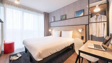 Desk, laptop workspace, blackout drapes, soundproofing