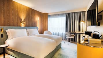 Luxe beddengoed, een minibar, een kluis op de kamer