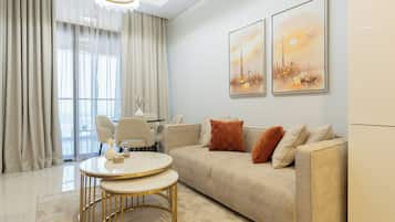 Deluxe Apartment, 2 Bedrooms, City View | Living area | 50-cm Smart TV with satellite channels