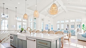 A spacious kitchen with a large island, pendant lighting, and a view to the living area. - Gulf View/Crow’s Nest@Cinnamon Shore South 4-BR Home w/Pools & Amenities (Port Aransas)
