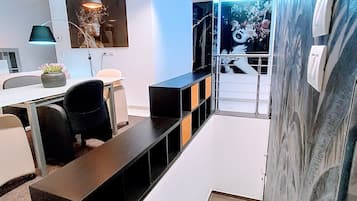 Deluxe Townhome, City View | Living area | 120-cm Smart TV with digital channels, smart speakers