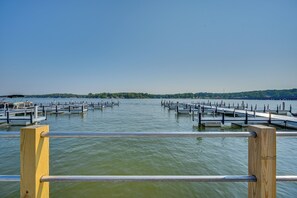 A marina with multiple docks extending into calm water, surrounded by a forested landscape. - Lake Greenwood Getaway w/ On-site Boat Ramp! (Greenwood)