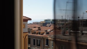 A view of a cityscape with traditional architecture and a clear sky. - Elegant Apartment in the Center by Wonderful Italy (Sanremo)